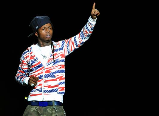 Lil Wayne performs during the Lil Wayne: I Am Music Tour World Tour at Time Warner Cable Arena in Charlotte, N.C., Jan. 2, 2009. Lil Wayne has since served a prison sentence, but that didn’t stop him from writing his latest album, “Tha Carter IV.”