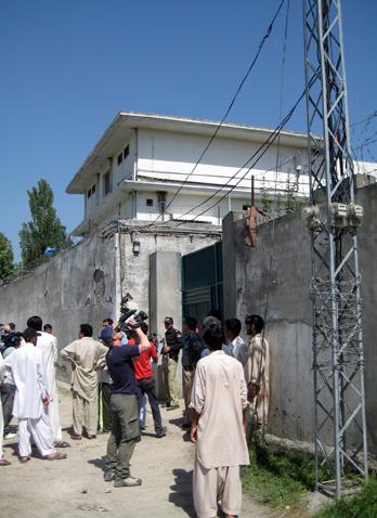 Residents of Abottabad, Pakistan, said they believed the two men who were hiding Osama bin Laden were either smugglers or gold merchants and that fact accounted for the unusual high and thick walls that had been built around the compound. More details emerged Tuesday, May 3, 2011, about the compound where a U.S. Navy Seal time killed bin Laden early Monday and the raid itself, including that the men assembled the land for the compound from several people in the area and supervised construction of the property itself. 