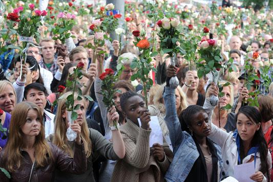 Mourners gather to remember those who fell victim to  the Breivik bombing.