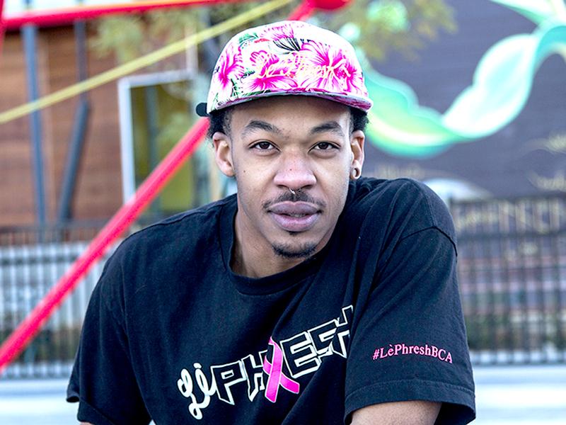 Princeton Faure poses in his Le Phresh Breast Cancer Awareness Tee.