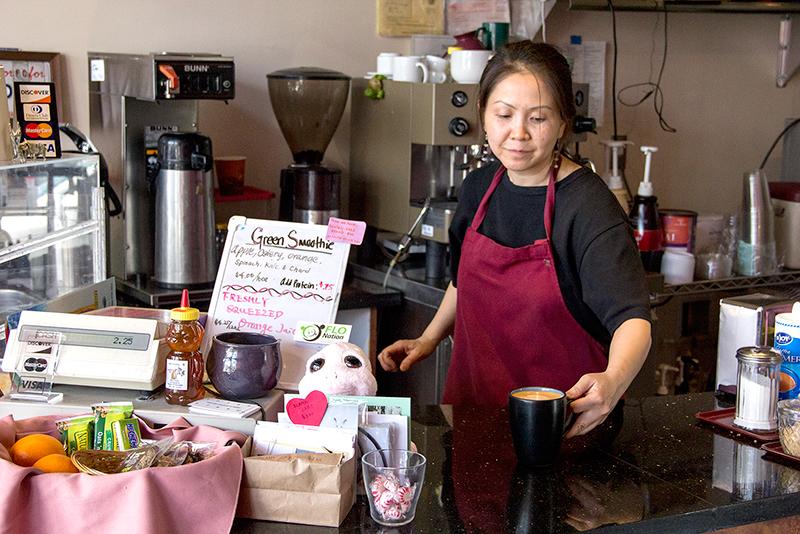 Yamaguchi+serves+an+unsweetened+fresh+latte+in+a+mug.