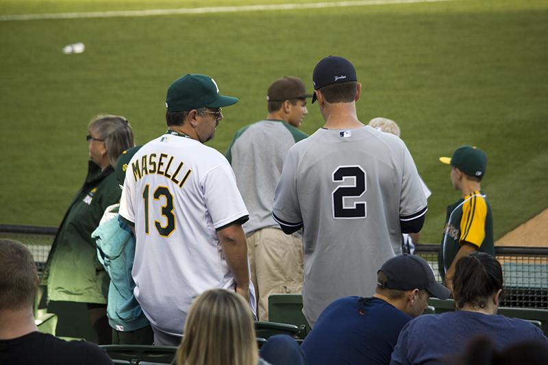 Spectators showed support by wearing jerseys. Some even watching with rival friends.