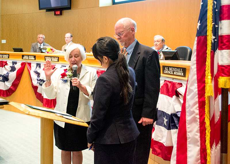 Hayward’s new Mayor Barbara Halliday accompanied by her husband, takes the oath of office.