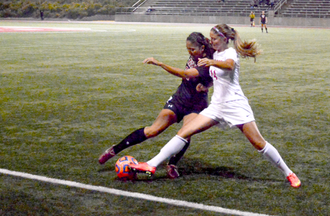 Beckah Anderson skirmishes with an opponent at Pioneer Stadium on Sept. 23.