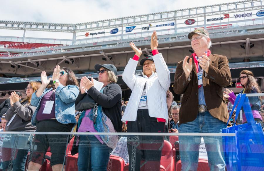 Event attendees applaud during the Freedom Summit, Saturday at Levi’s Stadium.