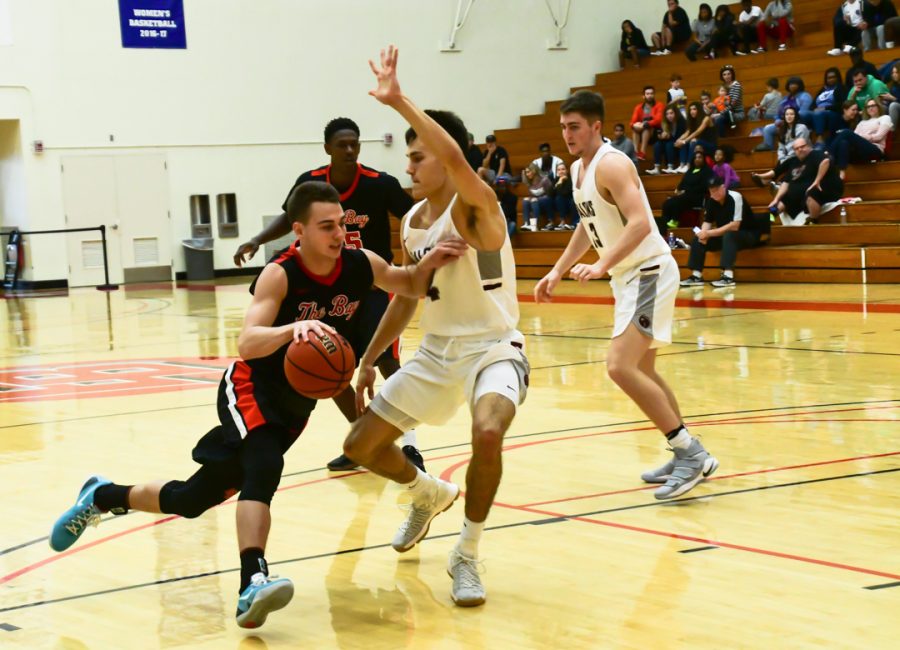 Cal State Eastbay junior guard Jordan Balser dribble across his opponent during
the game against Seattle Pacific Falcon held on 11 th November 2017 at Pioneer gymnasium in
Hayward.