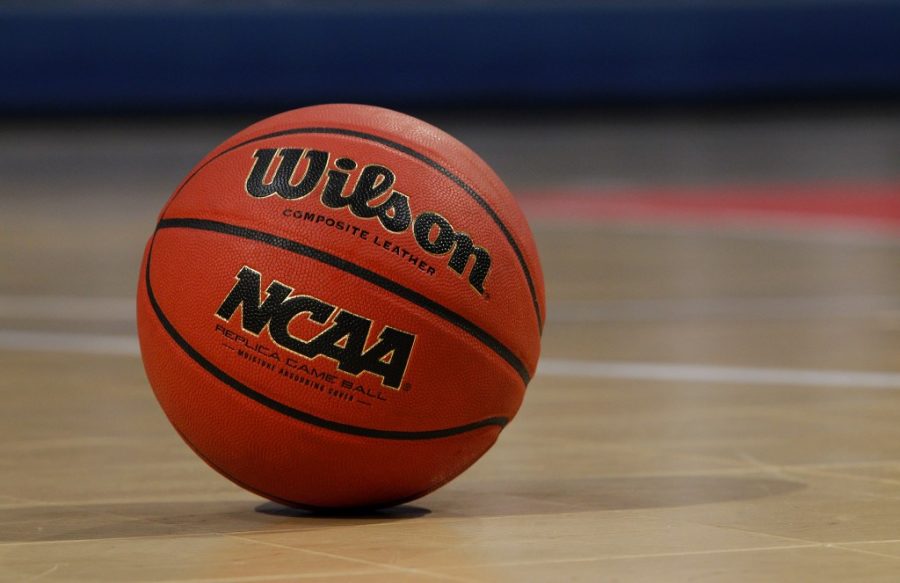 A detail view of an Wilson NCAA basketball is seen on a court at Bracket Town on Sunday April 3, 2011 in Houston, Texas. (AP Photo/Aaron M. Sprecher)