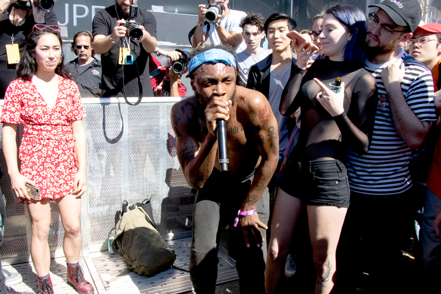 JPEGMafia performs in the crowd as onlookers watch and record with their phones during the 11th Annual Treasure Island Music Festival at Middle Shoreline Park on October 13, 2018.