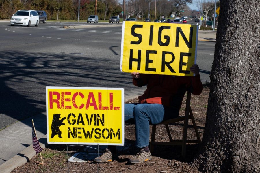 A 63-year-old local man, who goes by the name of Al, sits on the side of the road holding a poster that says ‘sign here,’ conveying to passersby that they can partake in signing the petition in the nearby parking lot. Al confessed that he works with “a lot of crazy liberals” and fears being identified and/or harassed for his political views.