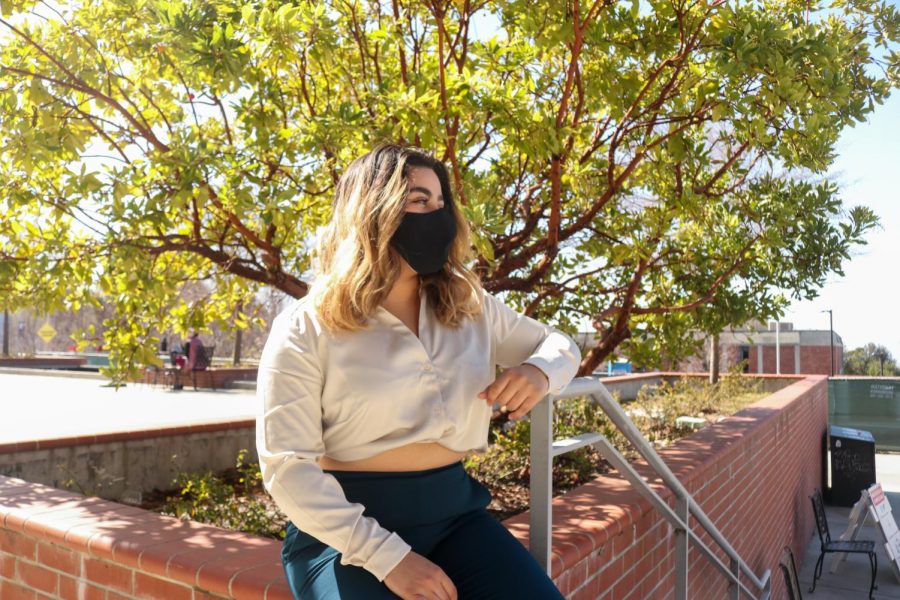 Euridice Pamela Sanchez sitting in the patio area in front of the Recreation and Wellness Center, or RAW, at CSUEB on March 4