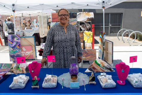 Charmeng Robinson (owner of Star Designs by Charmeng) stood for a photo in her stall at the flea market. 