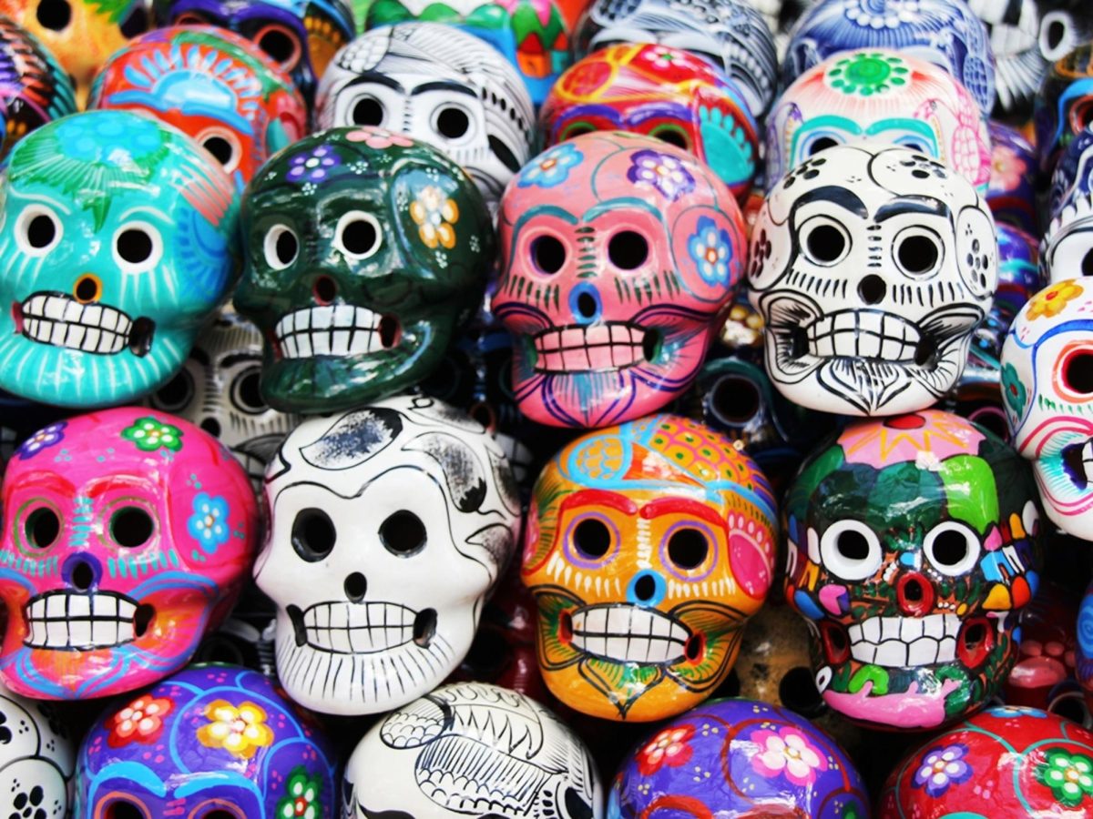 A+stack+of+colorful+skulls+for+celebration+of++Dia+de+los+Muertos