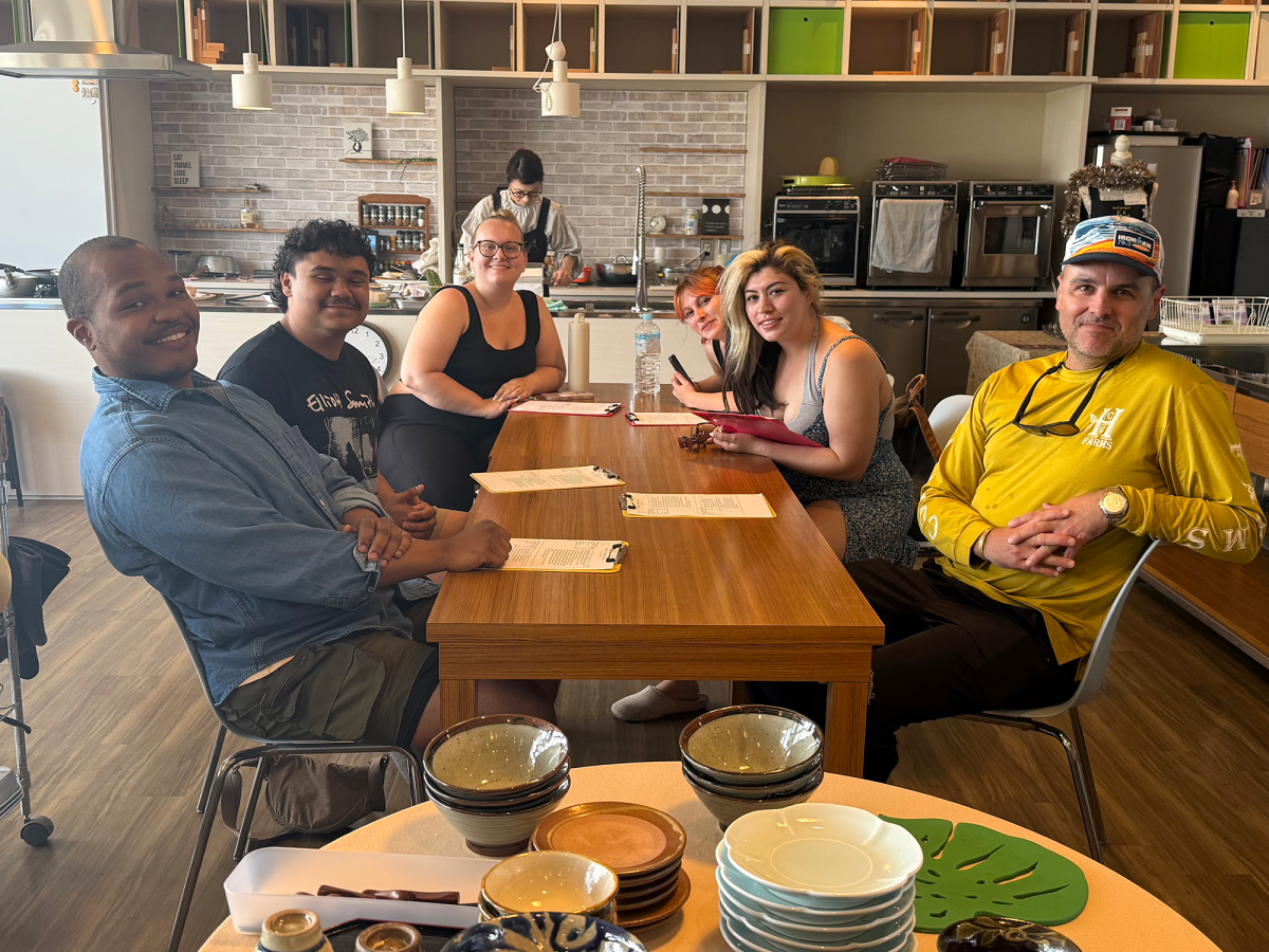 Students from CSU and UC campuses participate in an Okinawan cooking workshop as part of the Okinawa Memories Initiative. Workshops like this introduced students to traditional foodways and community-centered cooking practices.
