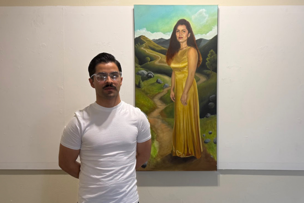 Juan Barboza posing with a painting of his mother on April 24, 2025.
