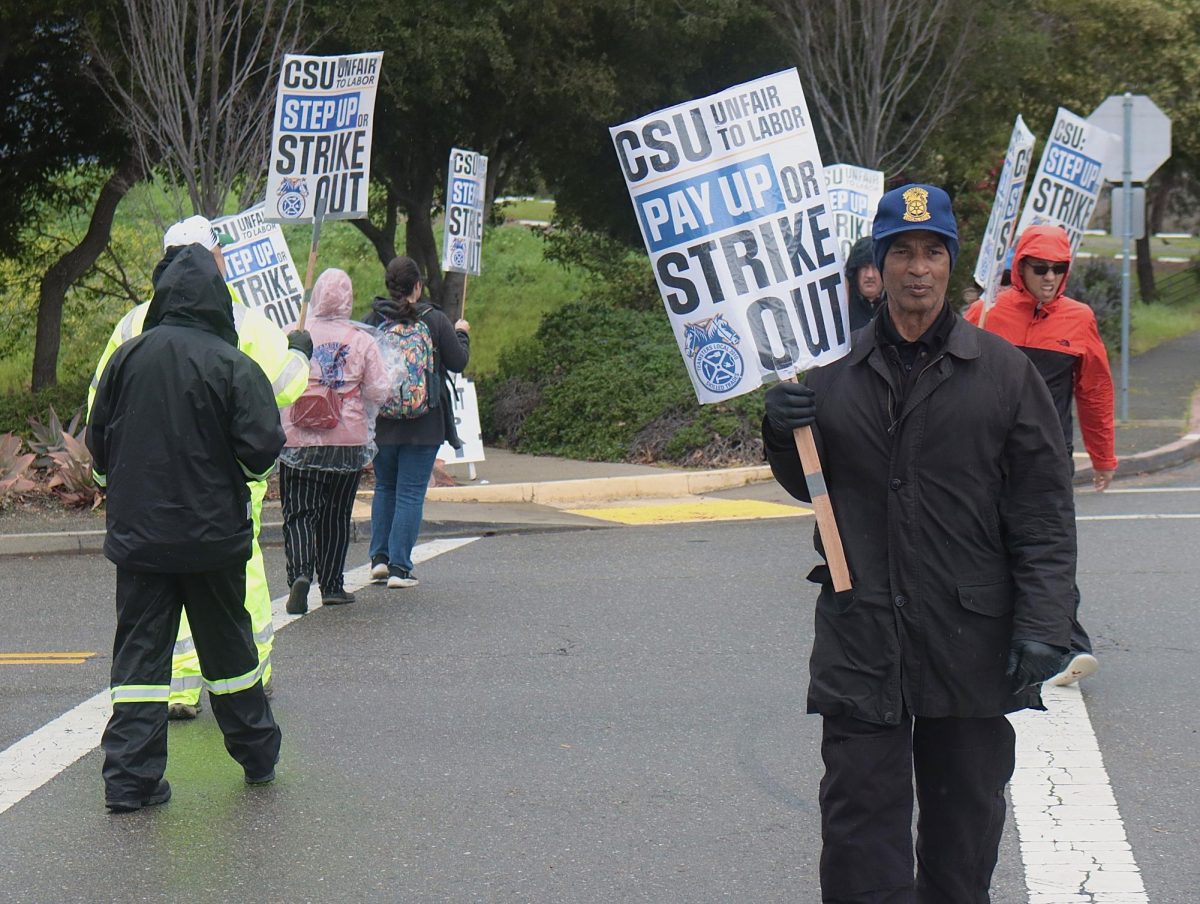 Teamsters Local 2010 members picketing at the Carlos Bee Boulevard entrance of California State University, East Bay, in Hayward.