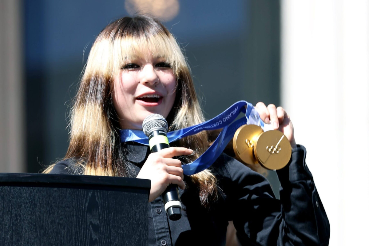 Alysa Liu displays the gold medals she won in figure skating at the 2026 Winter Olympics. 