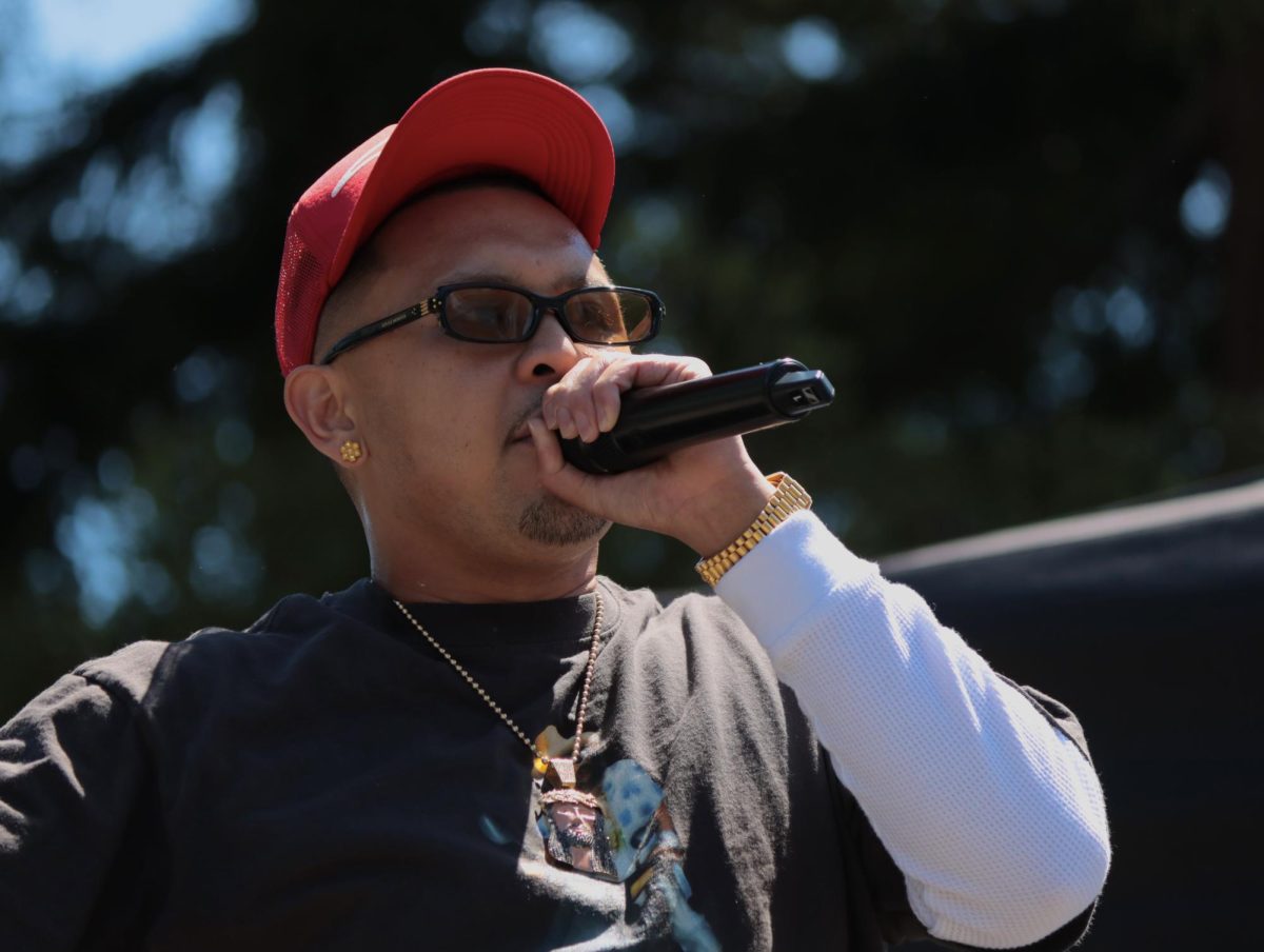 P-Lo performing in front of the University Amphitheater on April 23, 2026.